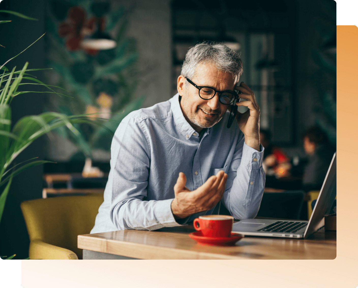 Mature-man-on-phone-in-a-cafe
